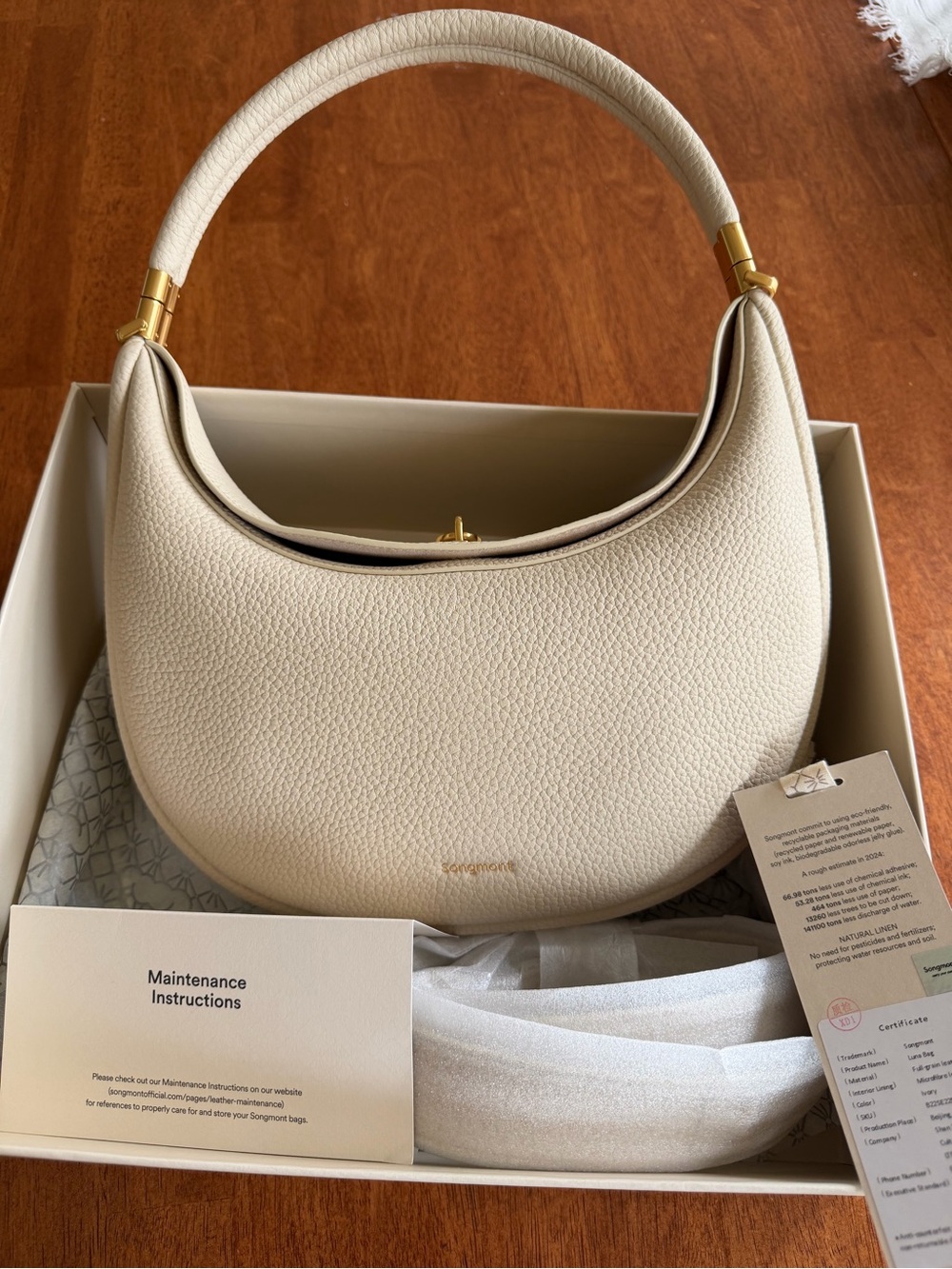 Songmont Luna Ivory Leather Crescent Shoulder Bag with Gold Accent